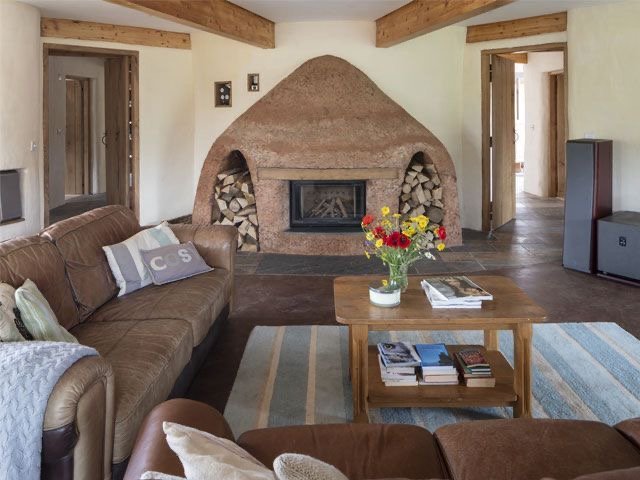 Cob and earth plaster fireplace