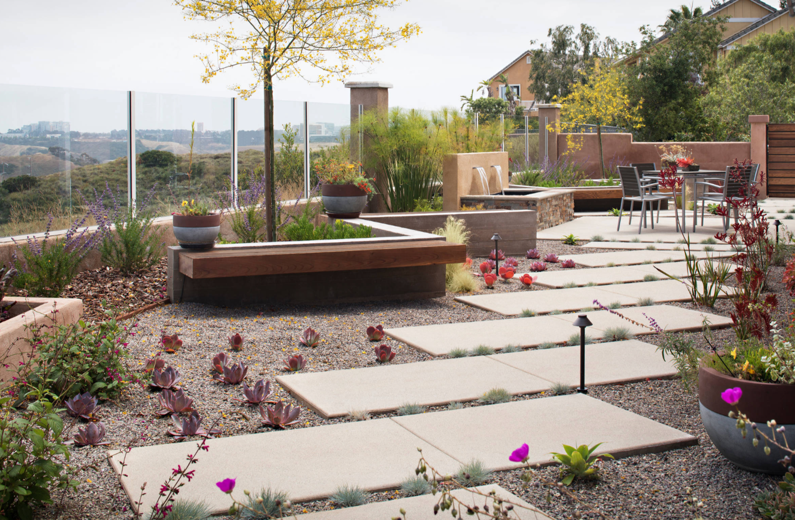 Modern xeriscape garden with concrete stepping stones