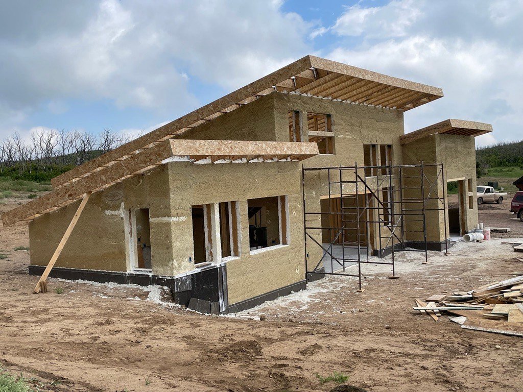 Hemp-lime building under construction with scaffolding
