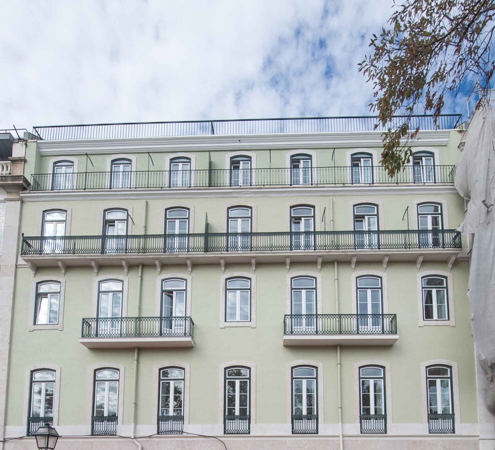 Renovated 19th century green heritage building facade, Lagos